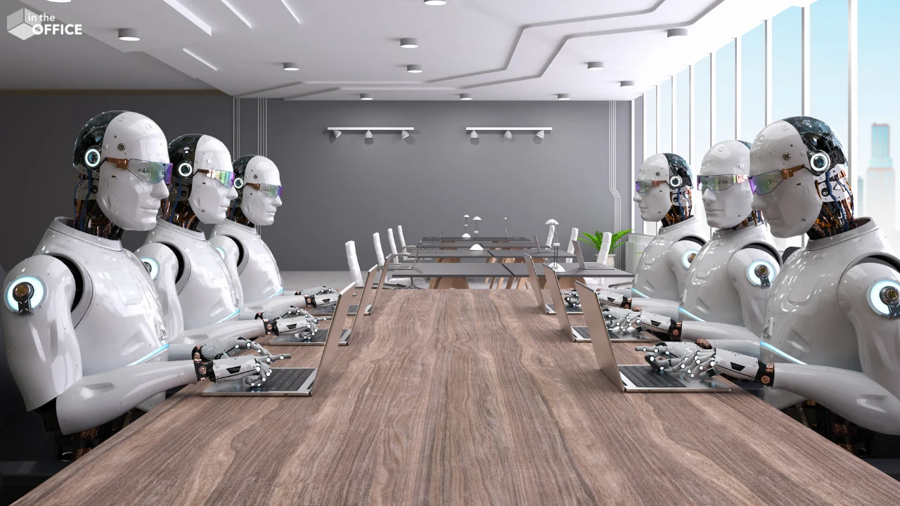 Rows of humanoid robots working on laptops at a boardroom table